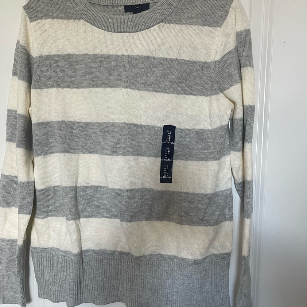 Gap sweater size large, color is gray with cream stripes. Sweater is new.